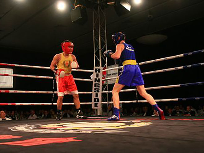 Two boxers fighting in the ring