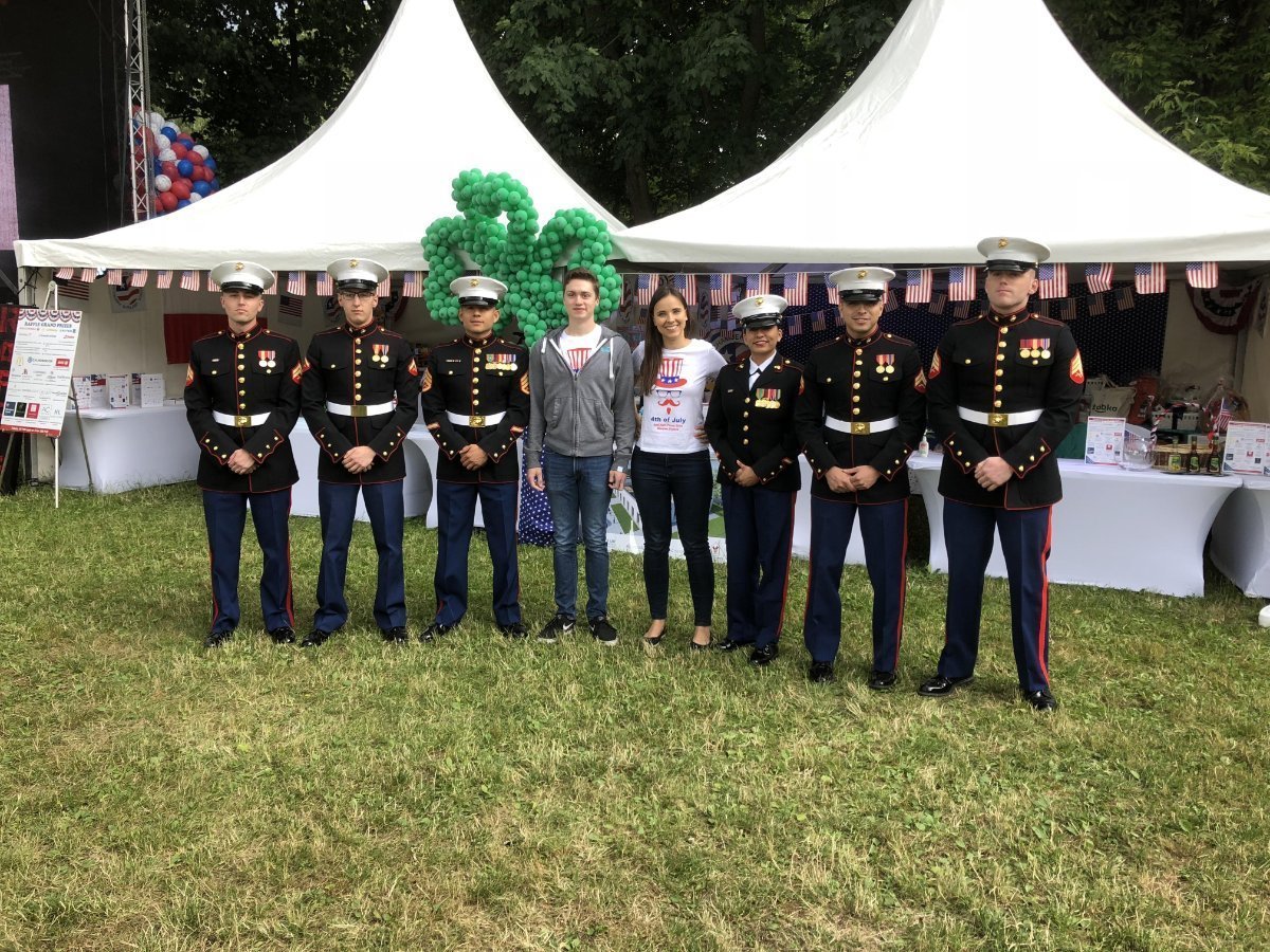 Photo taken of people posing with US Marines.